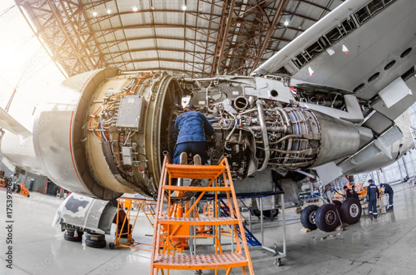 technician checking an airplane